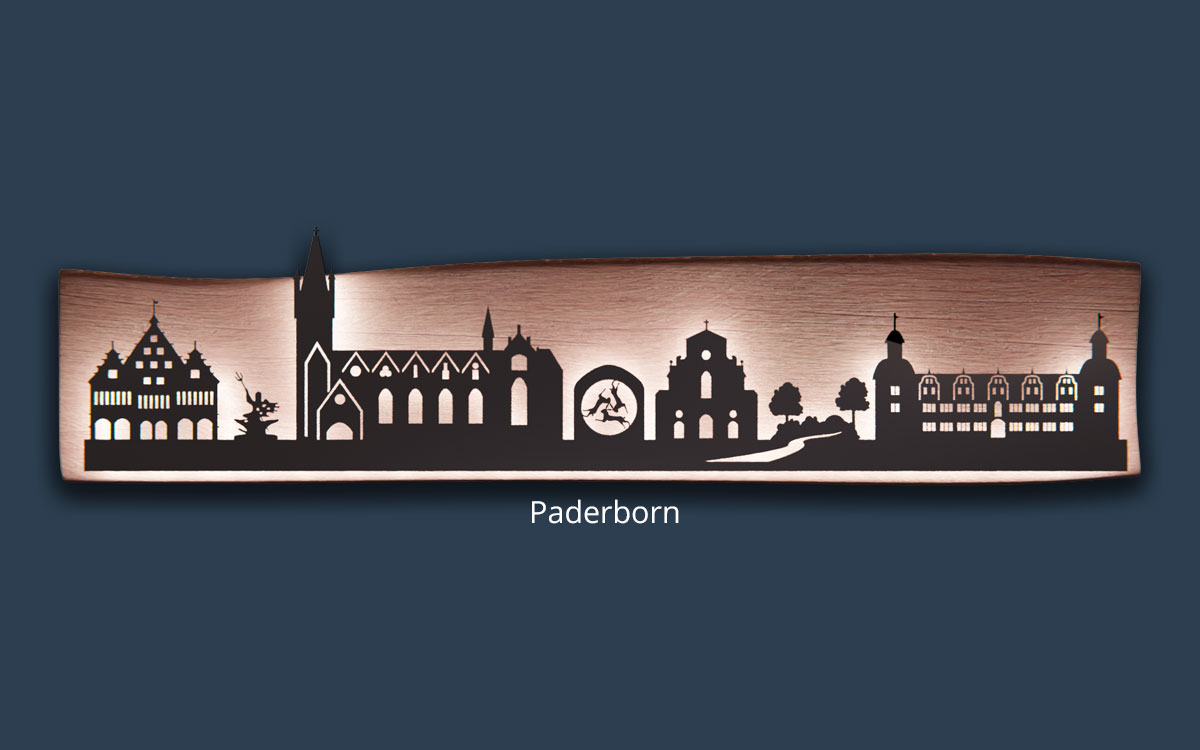 Skyline von Paderborn aus Edelstahl auf Massivholz mit indirekter LED-Beleuchtung
